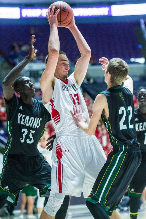 Chris Detrick  |  The Salt Lake Tribune
Kearns's Kur Kuath (35) and Kearns's Taylan Thomas (22) guard Bountiful's Jeffrey Pollard (13) during the 4A championship game at the Dee Events Center Saturday February 28, 2015.  Bountiful is winning the game 36-16 at halftime.