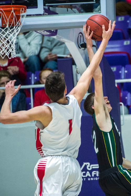Chris Detrick  |  The Salt Lake Tribune
Bountiful's Zachary Seljaas (1) blocks Kearns's Taylan Thomas (22) during the 4A championship game at the Dee Events Center Saturday February 28, 2015.  Bountiful is winning the game 36-16 at halftime.