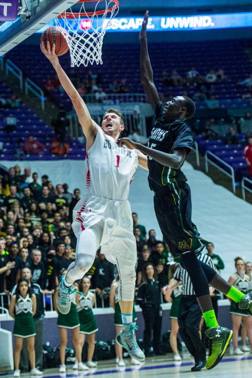 Chris Detrick  |  The Salt Lake Tribune
Bountiful's Zachary Seljaas (1) is blocked Kearns's Kur Kuath (35) during the 4A championship game at the Dee Events Center Saturday February 28, 2015.  Bountiful is winning the game 36-16 at halftime.