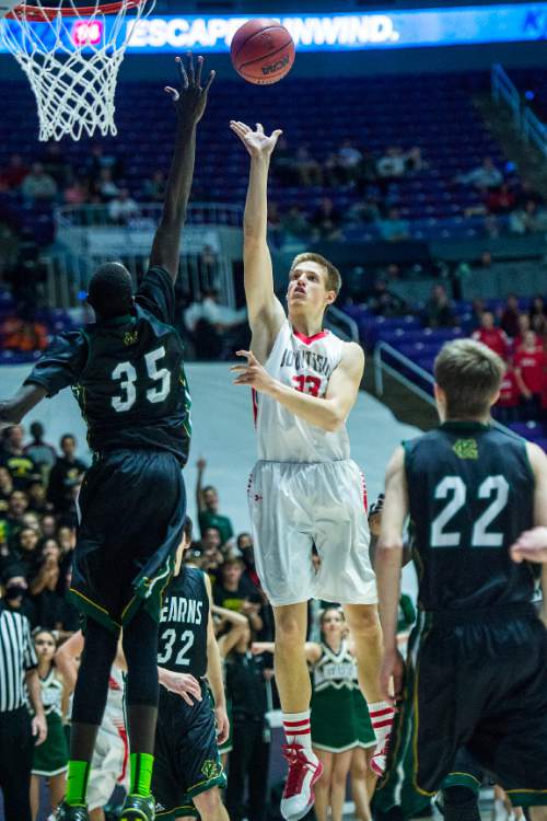 Chris Detrick  |  The Salt Lake Tribune
Bountiful's Collin Parrish (33) shoots over Kearns's Kur Kuath (35) during the 4A championship game at the Dee Events Center Saturday February 28, 2015.  Bountiful is winning the game 36-16 at halftime.