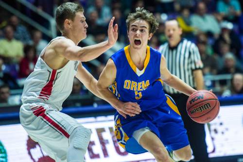 Chris Detrick  |  The Salt Lake Tribune
Orem's Jake Stayner (5) is guarded by Bountiful's Jacob LaSalle (3) during the 4A semifinal game at the Dee Events Center Friday February 27, 2015.  Bountiful is defeating Orem 43-13 at halftime.
