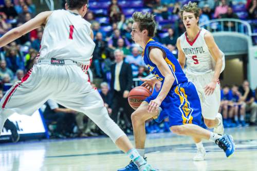 Chris Detrick  |  The Salt Lake Tribune
Orem's Jake Stayner (5) runs past Bountiful's Zachary Seljaas (1) and Bountiful's Austin Parkinson (5) during the 4A semifinal game at the Dee Events Center Friday February 27, 2015.  Bountiful is defeating Orem 43-13 at halftime.
