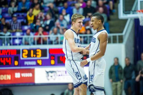 Chris Detrick  |  The Salt Lake Tribune
Layton's Dallin Watts (12)  and Layton's Julian Blackmon (1)  celebrate during the 5A semifinal game at the Dee Events Center Friday February 27, 2015.  Layton defeated Viewmont 48-41.