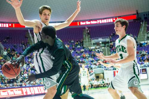 Chris Detrick  |  The Salt Lake Tribune
Kearns's Journey BuBa (2) passes around Olympus's Jake Lindsey (21)  and Olympus's Nathaniel Fox (3) during the 4A semifinal game at the Dee Events Center Friday February 27, 2015.  Kearns defeated Olympus 63-52