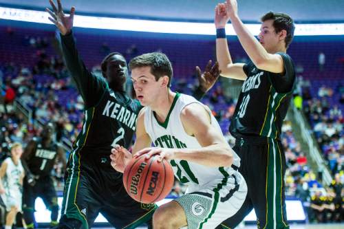 Chris Detrick  |  The Salt Lake Tribune
Olympus's Jake Lindsey (21) is guarded by Kearns's Journey BuBa (2) and Kearns's Tayler Marteliz (10) during the 4A semifinal game at the Dee Events Center Friday February 27, 2015.