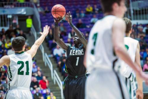 Chris Detrick  |  The Salt Lake Tribune
Kearns's Bushmen Ebet (1) shots past Olympus's Jake Lindsey (21) during the 4A semifinal game at the Dee Events Center Friday February 27, 2015.
