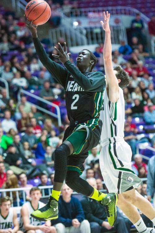 Chris Detrick  |  The Salt Lake Tribune
Kearns's Journey BuBa (2) shoots past Olympus's Nathaniel Fox (3) during the 4A semifinal game at the Dee Events Center Friday February 27, 2015.
