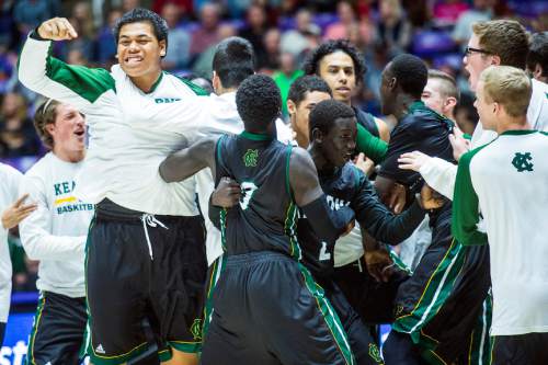 Chris Detrick  |  The Salt Lake Tribune
Members of the Kearns basketball team celebrate after winning the 4A semifinal game at the Dee Events Center Friday February 27, 2015.  Kearns defeated Olympus 63-52