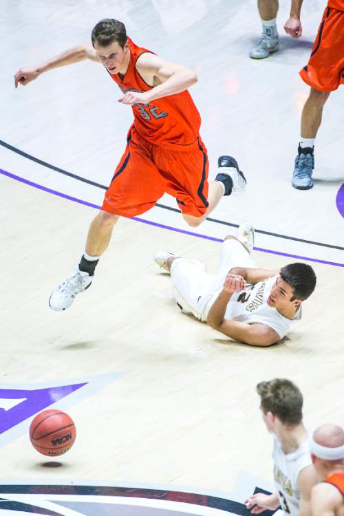Chris Detrick  |  The Salt Lake Tribune
Brighton's John Gremillion (32) and Davis' Mitch Sanders (22) go for the ball during the 5A semifinal game at the Dee Events Center Friday February 27, 2015.  Brighton defeated Davis 64-62.