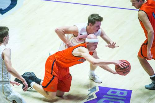 Chris Detrick  |  The Salt Lake Tribune
Brighton's Brock Miller (3) and Davis' Landon Swartz (3) go for the ball during the 5A semifinal game at the Dee Events Center Friday February 27, 2015.  Brighton defeated Davis 64-62.