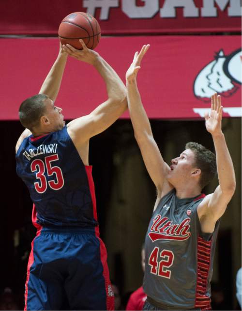 Rick Egan  |  The Salt Lake Tribune

Arizona Wildcats center Kaleb Tarczewski (35) shoots over Utah Utes Jakob Poelti, in Pac-12 basketball action in the Huntsman Center, Saturday, February 28, 2015.