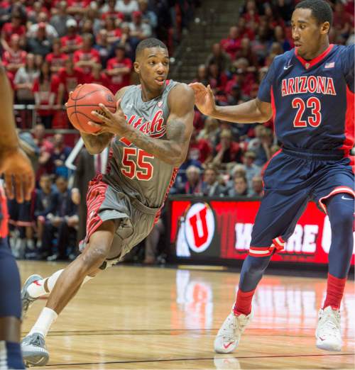 Rick Egan  |  The Salt Lake Tribune

Utah guard Delon Wright (55) takes the ball inside, as aa23 defends, in Pac-12 basketball action in the  Huntsman Center, Saturday, February 28, 2015.
