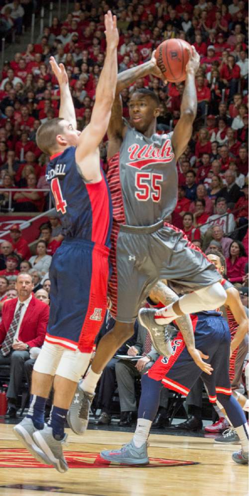 Rick Egan  |  The Salt Lake Tribune

Utah Utes guard Delon Wright (55) makes a pass, as Arizona Wildcats guard T.J. McConnell (4) defends, in Pac-12 basketball action in the Huntsman Center, Saturday, February 28, 2015.