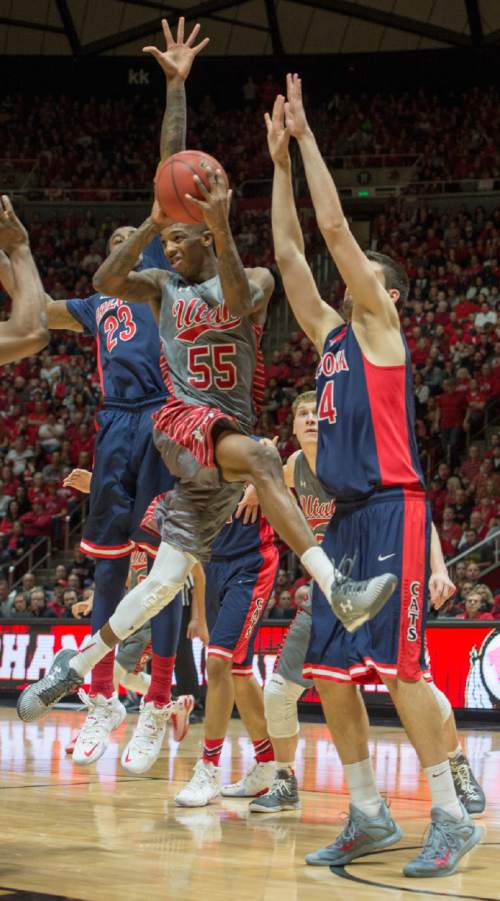 Rick Egan  |  The Salt Lake Tribune

Utah Utes guard Delon Wright (55) makes a pass, as Arizona Wildcats guard T.J. McConnell (4) defends, in Pac-12 basketball action in the Huntsman Center, Saturday, February 28, 2015.