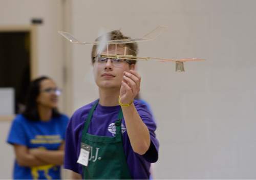 Scott Sommerdorf   |  The Salt Lake Tribune
J.J. Keeney of Lehi High flies his "Albatross" airplane during the Regional Science Olympiad at Westminster College. Westminster College hosted 500 middle and high school students as they competed in the 2015 Northern Regional Science Olympiad, Saturday, February 28, 2015.