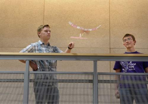Scott Sommerdorf   |  The Salt Lake Tribune
Ben James, oft, and Matthew Obray, of Riverton High fly their balsawood airplane during the Regional Science Olympiad held at Westminster College, Saturday, February 28, 2015.