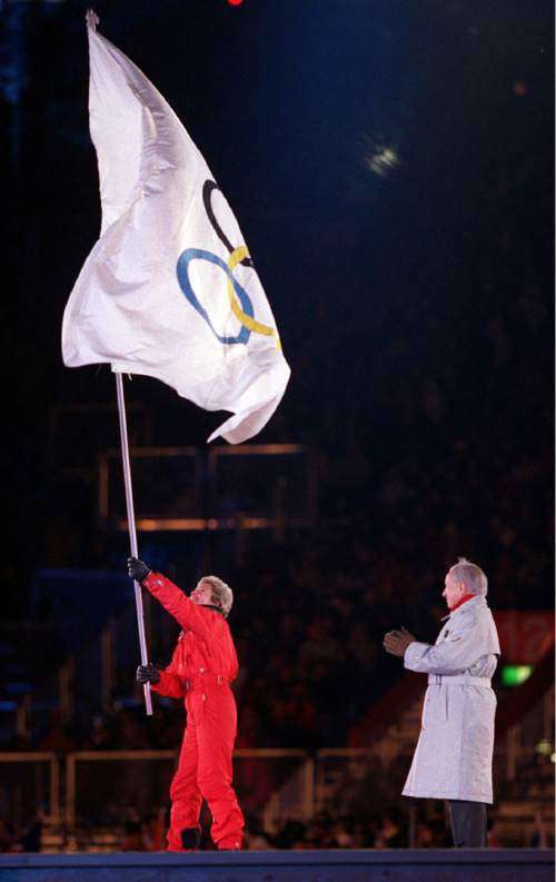 Salt Lake City Mayor Deedee Corradini waves the Olympic flag after receiving it from IOC President Juan Antonio Samaranch during the closing ceremony of the 1998 Nagano Olympics in Nagano, Japan. Corradini, the only female mayor in the history of Salt Lake City who helped bring the Winter Olympics to Utah, died Sunday, March 1, 2015, at her home in Park City from the effects of lung cancer, according to a Women's Ski Jumping USA news release. She was 70. (AP Photo/The Salt Lake Tribune, Rick Egan)  DESERET NEWS OUT; LOCAL TELEVISION OUT; MAGS OUT