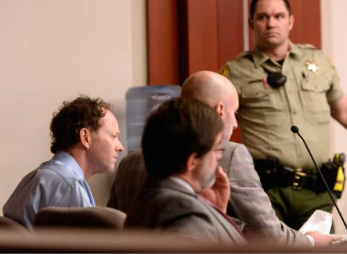 Al Hartmann  |  The Salt Lake Tribune
 Johnny Brickman Wall, left, sits with his defense team in 3rd District Court Monday March 2, 2015, in Salt Lake City.  Wall is accused of killing his former wife, researcher Uta von Schwedler, in her Sugar House home in September 2011.