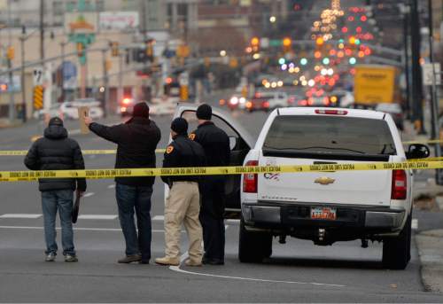 Al Hartmann  |  The Salt Lake Tribune
Salt Lake City Police investigate an officer-involved shooting at 1110 South State Street Tuesday, March 3.  A white pickup truck was involved.  State Street between 900 South and 1300 was closed for several hours.
