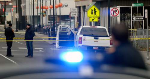 Al Hartmann  |  The Salt Lake Tribune
File photo. Police investigate a shooting in Salt Lake City.