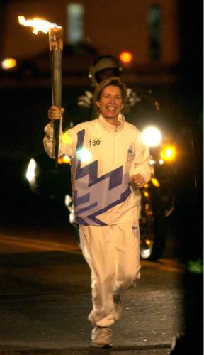 Steve Griffin  |  The Salt Lake Tribune

Former Salt Lake City Mayor Deedee Corradini carries the Olympic Torch through the streets of Greenville, South Carolina, on Dec. 4, 2001.