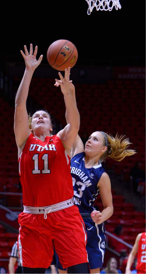 Leah Hogsten  |  The Salt Lake Tribune
Utah Utes forward Taryn Wicijowski (11) hits the net. The University of Utah trail Brigham Young University 32-29, Saturday, December 13, 2014 at the Jon M. Huntsman Center.