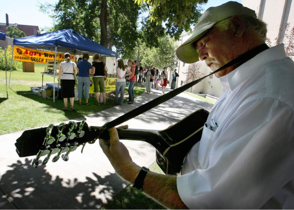 UofU MARKET
Mike Hines plays a tune on his "Octave Mandolin" under a tree during the UofUtah farmer's Market. The University of Utah is sponsoring a Farmers Market on its campus - farmers will be be there as well for today, Thursday 8/28/08.
Scott Sommerdorf / The Salt Lake Tribune