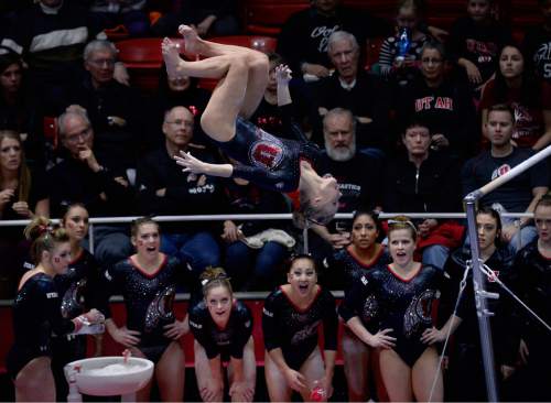 Scott Sommerdorf   |  The Salt Lake Tribune
Team mates watch as Georgia Dabritz competes in the uneven parallel bars as Utah Gymnastics defeated UCLA 196.725 - 194.725 in the Huntsman Center, Friday, January 23, 2015.