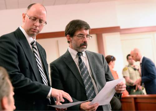 Al Hartmann  |  The Salt Lake Tribune 
Prosecuter Matthew Janzen, left, and defense lawyer Fred Metos confer in 3rd District Court Wednesday March 4 in Salt Lake City during Johnny Brickman Wall's murder trial.  Wall, a former Utah pediatrician, is accused of killing his ex-wife, Uta von Schwedler at her Sugar House home in 2011.
