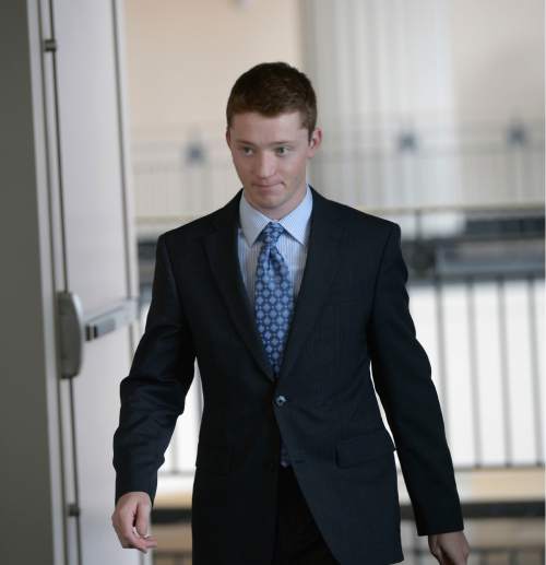 Al Hartmann  |  The Salt Lake Tribune 
Pelle Wall, oldest son of Johnny Brickman Wall and Uta von Schwedler, walks to 3rd District Court in Salt Lake City Wednesday March 4, 2015. Johnny Wall, a former Utah pediatrician, is accused of killing his ex-wife, Uta von Schwedler, at her Sugar House home in 2011.