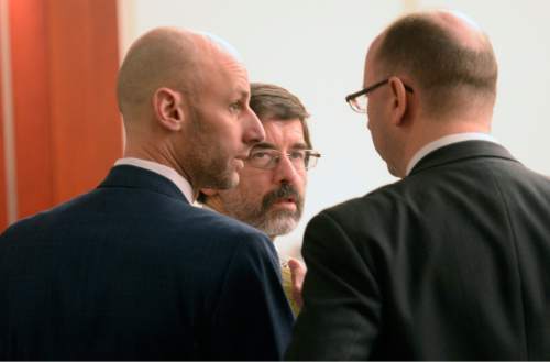 Al Hartmann  |  The Salt Lake Tribune 
Johnny Brickman Wall's defense team Jeremy Delicino, left, and Fred Metos, confer with prosecutor Matthew Janzen in 3rd District Court Wednesday March 4, 2015, in Salt Lake City. Wall, a former Utah pediatrician, is accused of killing his ex-wife, Uta von Schwedler, at her Sugar House home in 2011.