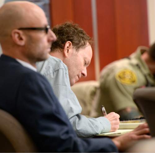 Al Hartmann  |  The Salt Lake Tribune 
Johnny Brickman Wall takes notes during testimony in Third District Court in Salt Lake City Wednesday March 4. Wall, a former Utah pediatrician, is accused of killing his ex-wife, Uta von Schwedler at her Sugar House home in 2011.