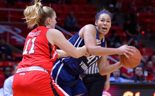 Leah Hogsten  |  The Salt Lake Tribune
Brigham Young Cougars forward Morgan Bailey (41) looks for the pass against the heavy defense of Utah Utes forward Taryn Wicijowski (11). The University of Utah lost to  Brigham Young University 60-56, Saturday, December 13, 2014 at the Jon M. Huntsman Center.