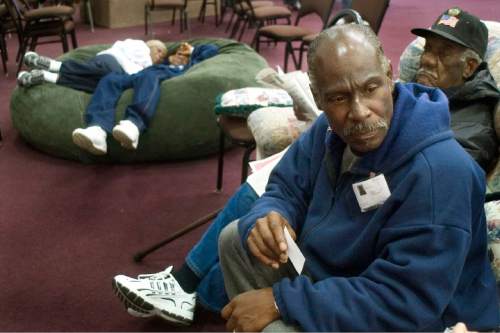 Steve Griffin | Tribune file photo
Curtis Crosby (front) sits in the community center at Camp Williams in September 2005 with his friend Danial Holden, 85, from St. Mary Parish near New Orleans. Crosby, who had been living in South Salt Lake, was reported missing in December.