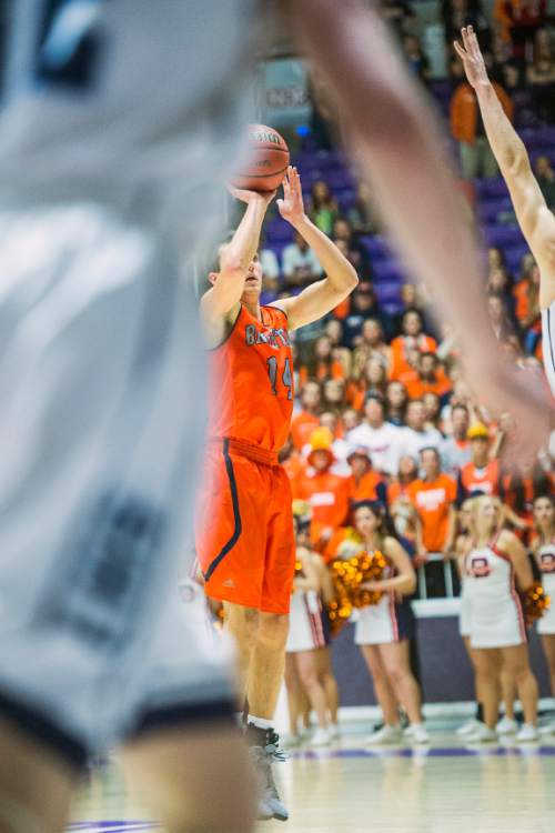 Chris Detrick  |  The Salt Lake Tribune
Brighton's Derek Devashrayee (14) shoots the ball during the 5A championship game at the Dee Events Center Saturday February 28, 2015.  Brighton is winning the game 27-20 at halftime.