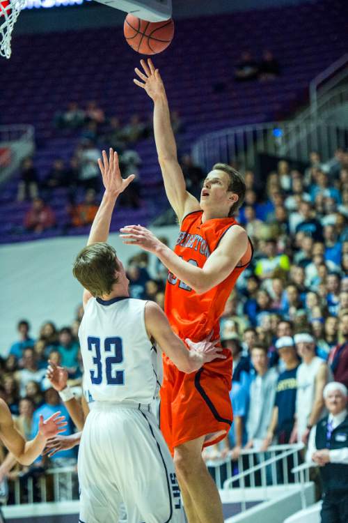 Chris Detrick  |  The Salt Lake Tribune
Brighton's John Gremillion (32) shoots past Layton's Cody Edwards (32) during the 5A championship game at the Dee Events Center Saturday February 28, 2015.  Brighton is winning the game 27-20 at halftime.