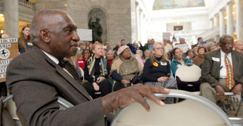 Al Hartmann  |  The Salt Lake Tribune 
Rev. France Davis listens to speakers at a rally Thursday for the Healthy Utah Medicaid-expanison plan in the Utah Capitol. Hundreds attended the rally, held just hours after a House committee on Wednesday night rejected the Senate-approved legislation.