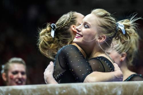 Chris Detrick  |  The Salt Lake Tribune
Utah's Georgia Dabritz gets a hug from her teammates after competing on the beam during the gymnastics meet against Michigan at the Jon M. Huntsman Center Friday March 6, 2015. Utah defeated Michigan 198.250 to 197.675. Dabritz scored a 9.9.