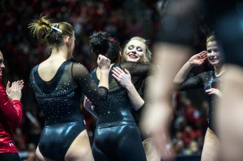 Chris Detrick  |  The Salt Lake Tribune
Utah's Georgia Dabritz gets hugs from her teammates after competing on the floor during the gymnastics meet against Michigan at the Jon M. Huntsman Center Friday March 6, 2015. Utah defeated Michigan 198.250 to 197.675. Dabritz scored a 9.950.