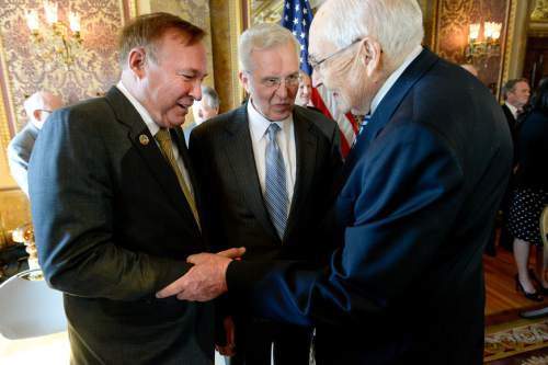 Francisco Kjolseth  |  The Salt Lake Tribune 
Sen. Jim Dabakis, D-Salt Lake, left, greets top Mormon leaders, including apostle D. Todd Christofferson, center, and L. Tom Perry, second in line for the LDS Church's presidency, as they appear at a news conference at the Capitol to publicly endorse nondiscrimination bill SB296.