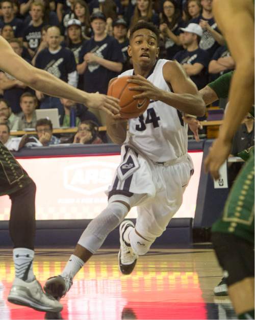 Rick Egan  |  The Salt Lake Tribune

Aggie guard Chris Smith (34) drives up the middle, in basketball action, Utah State vs. Colorado State, in Logan, Saturday, March 7, 2015