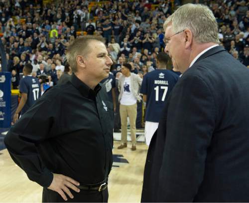 Rick Egan  |  The Salt Lake Tribune

Colorado State Rams head coach, Larry Eustachy talks with Utah State Aggies head coach Stew Morrill before the Utah State vs. Colorado State game in Logan, Saturday, March 7, 2015