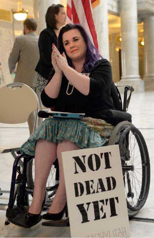 Al Hartmann  |  The Salt Lake Tribune 
Stacy Stanford, a Westminster College student, gets set to speak at the Capitol Rotunda on Thursday, March 5, 2015. She and hundreds of citizens and advocates of the governor's plan to expand Medicaid, Healthy Utah, rallied.  She uses a wheelchair after an auto accident resulted in a neurolgical disorder. She is uninsured.