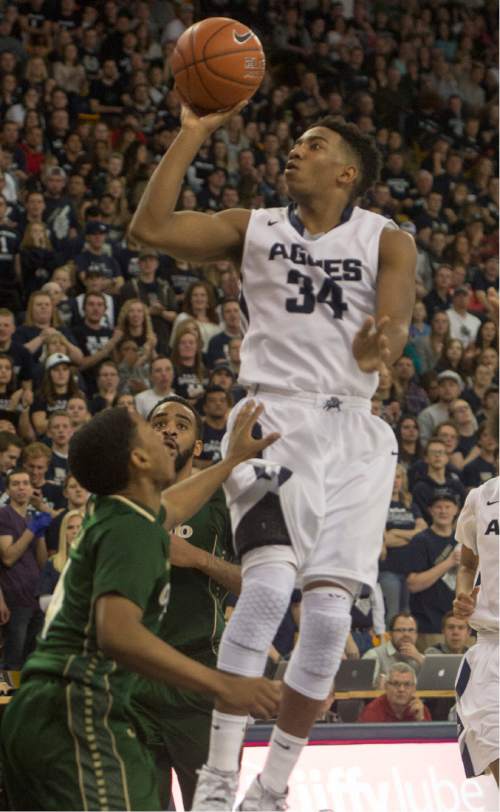 Rick Egan  |  The Salt Lake Tribune

Utah State guard Chris Smith (34) goes in for an easy two points for the Aggies, in basketball action, Utah State vs. Colorado State, in Logan, Saturday, March 7, 2015