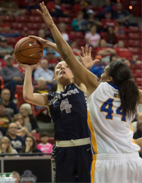 Rick Egan  |  The Salt Lake Tribune

San Jose State Spartans center Riana Byrd (44) defends as Utah State Aggies guard/forward Tilar Clark (4) shoots, in the Mountain West Conference Basketball Championships, at the Thomas & Mac Center, in Las Vegas,  Monday, March 9, 2015