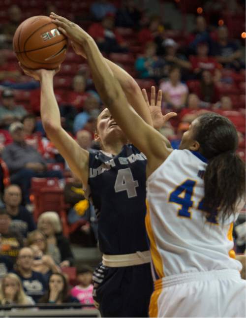 Rick Egan  |  The Salt Lake Tribune

San Jose State Spartans center Riana Byrd (44) blocks a shot by Utah State Aggies guard/forward Tilar Clark (4), in the Mountain West Conference Basketball Championships, at the Thomas & Mac Center, in Las Vegas,  Monday, March 9, 2015