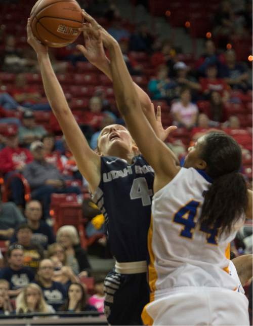 Rick Egan  |  The Salt Lake Tribune

San Jose State Spartans center Riana Byrd (44) blocks a shot by Utah State Aggies guard/forward Tilar Clark (4), in the Mountain West Conference Basketball Championships, at the Thomas & Mac Center, in Las Vegas,  Monday, March 9, 2015
