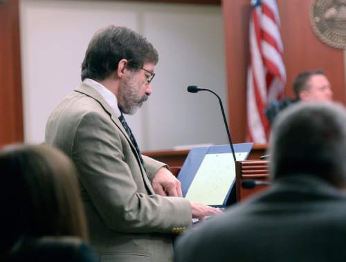 Al Hartmann  |  The Salt Lake Tribune 
Defense lawyer Fred Metos, left, questions Dr. Judy Melinek on the witness stand in 3rd District Court Monday March 9, 2015, in Salt Lake City in Johnny Brickman Wall's murder trial. Wall, a former Utah pediatrician, is accused of killing his ex-wife, Uta von Schwedler, at her Sugar House home in 2011.