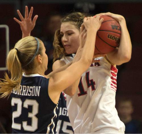 Rick Egan  |  The Salt Lake Tribune

Brigham Young Cougars guard Makenzi Morrison (23) tries to wrestle the ball from Gonzaga Bulldogs forward Sunny Greinacher (14), in the West Coast Conference Basketball Championships, at the Orleans Arena, in Las Vegas,  Monday, March 9, 2015