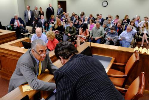 Francisco Kjolseth  |  The Salt Lake Tribune 
Salt Lake County District Attorney Sim Gill speaks with with Rep. Mark Wheatley, D-Murray, before a packed House Judiciary Committee hearing for SB296 the antidiscrimination bill Tuesday, March, 10, 2015.